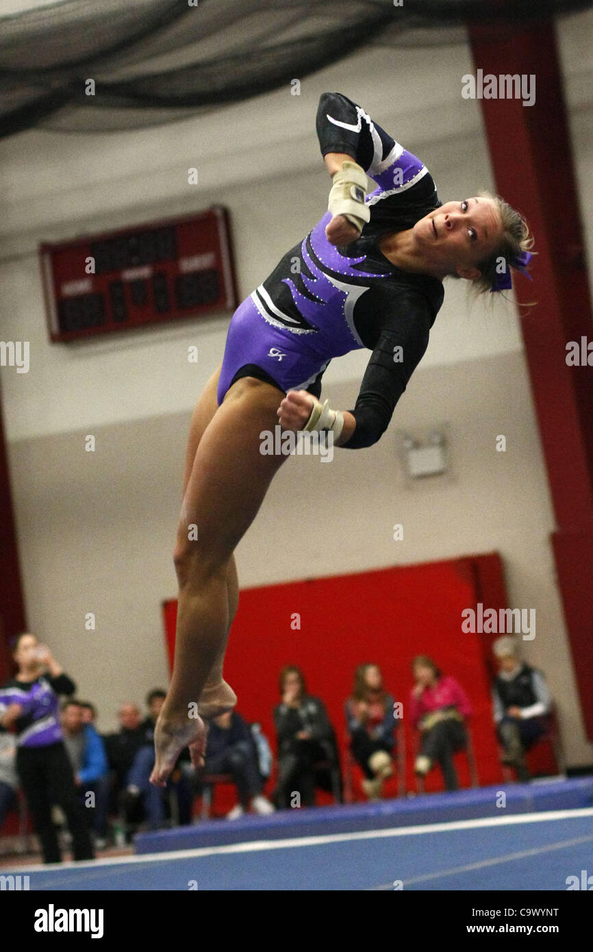 Winona State University gymnast Chelsea Lindeman flies up during her floor routine in a competition against Hamline University at the Hamline field house, Saint Paul, Minnesota, Feb. 26, 2012. Winona State University won the event. Stock Photo