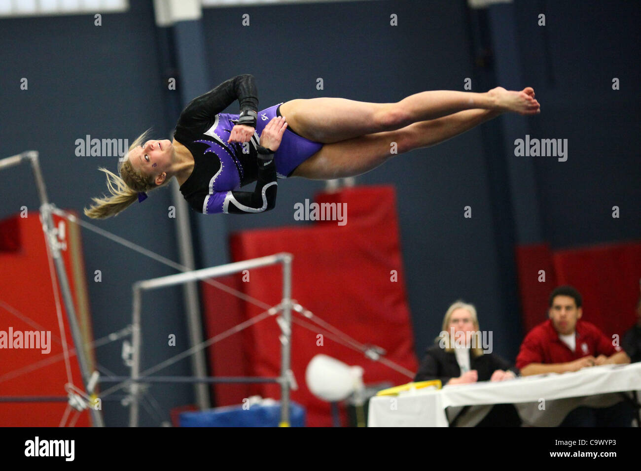 Winona State University gymnast Brooke Baures sails through her floor routine during a competition against Hamline University at the Hamline field house, Saint Paul, Minnesota, Feb. 26, 2012. Winona State won the meet. Stock Photo