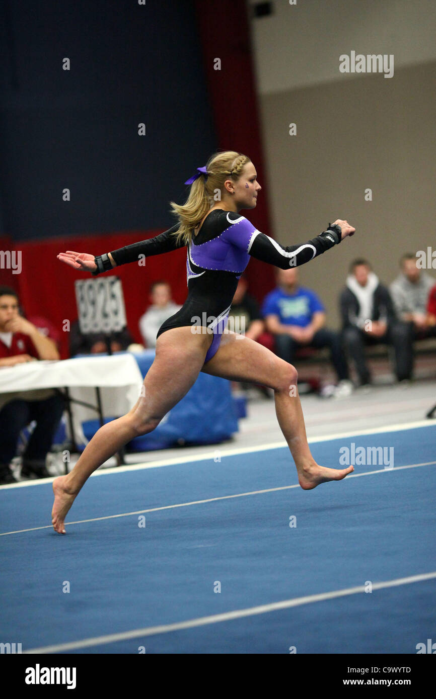 Winona State University gymnast Brooke Baures prepares to commence a series of flips during her floor routine in a competition against Hamline University at the Hamline field house, Saint Paul, Minnesota, Feb. 26, 2012. Winona State won the meet. Stock Photo