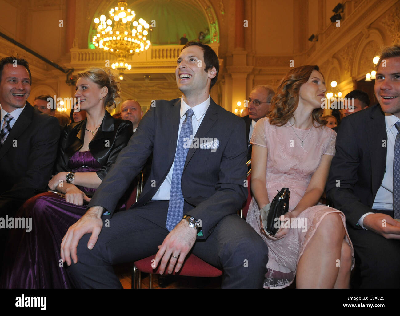 Chelsea's goalkeeper Petr Cech, centre (at his left hand sits his wife Martina), attends the galaevening at which he was awarded the title Soccerplayer of the Year in the Czech Republic for the fifth time in Prague Monday, Feb. 27, 2012. (CTK Photo/Roman Vondrous) Stock Photo