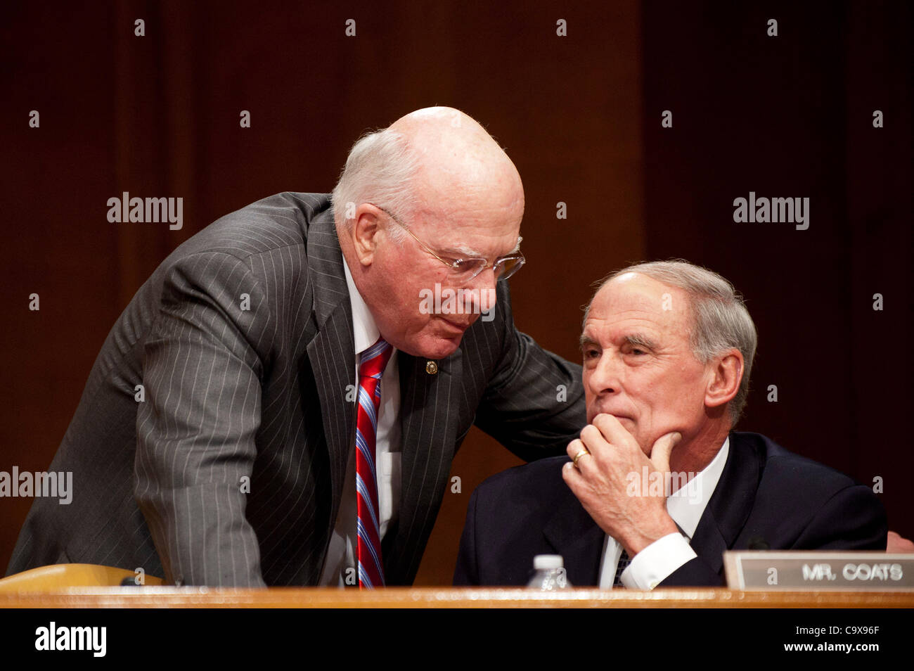 Feb. 28, 2012 - Washington, District of Columbia, U.S. - Senators PATRICK LEAHY (D-VT) and DAN COATS (R-IN) confer as Secretary of State Hillary Clinton testifies on the FY2013 Dept. of State and Foreign Operations Budget before the Senate Appropriations Committee on Capitol Hill Tuesday. (Credit Im Stock Photo