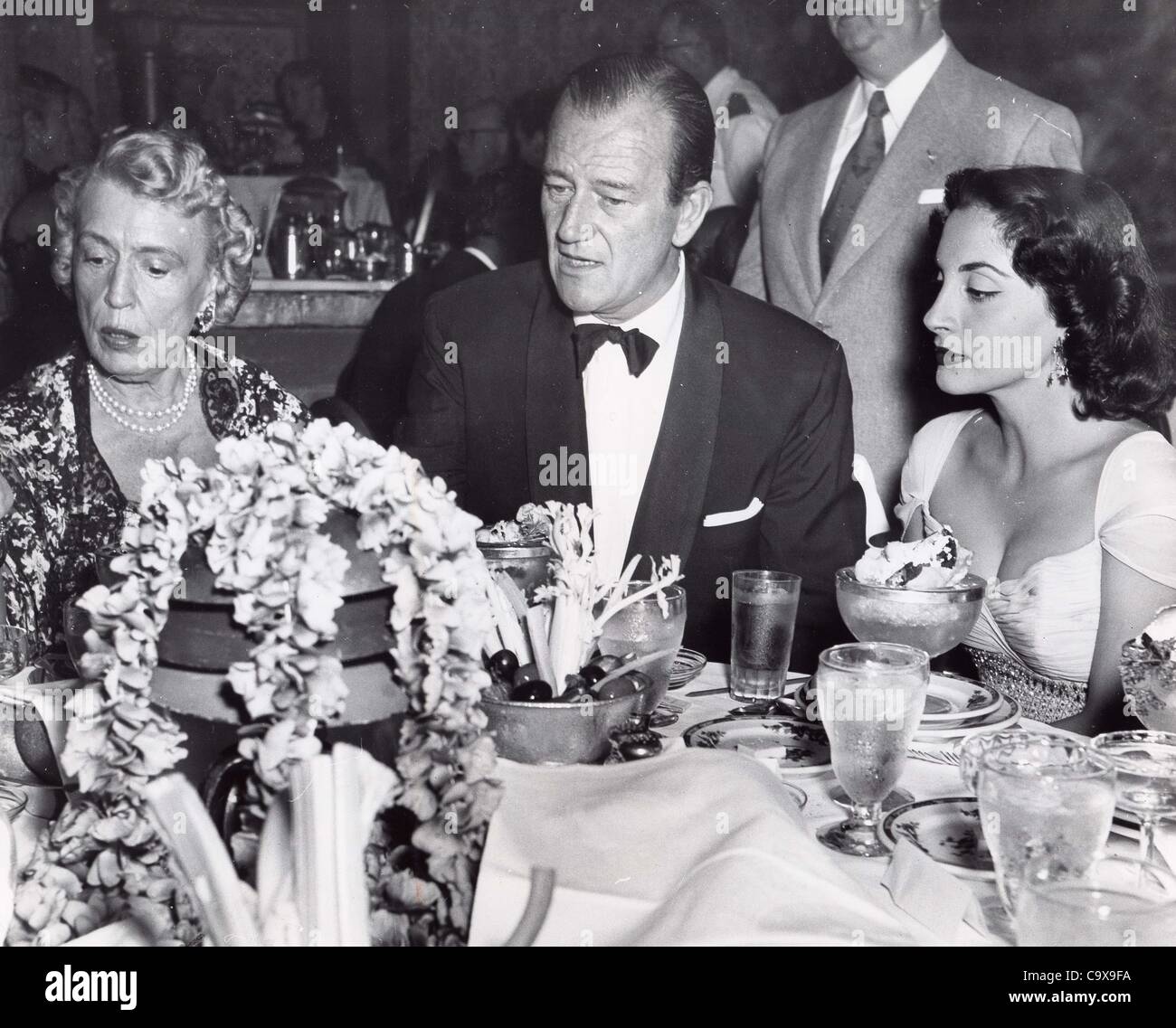 JOHN WAYNE Pilar Wayne and Cobina Wright Sr. at Cocoanut Grove for Jimmy McHughs opening 1953.Supplied by   Photos, inc.(Credit Image: Â© Supplied By Globe Photos, Inc/Globe Photos/ZUMAPRESS.com) Stock Photo