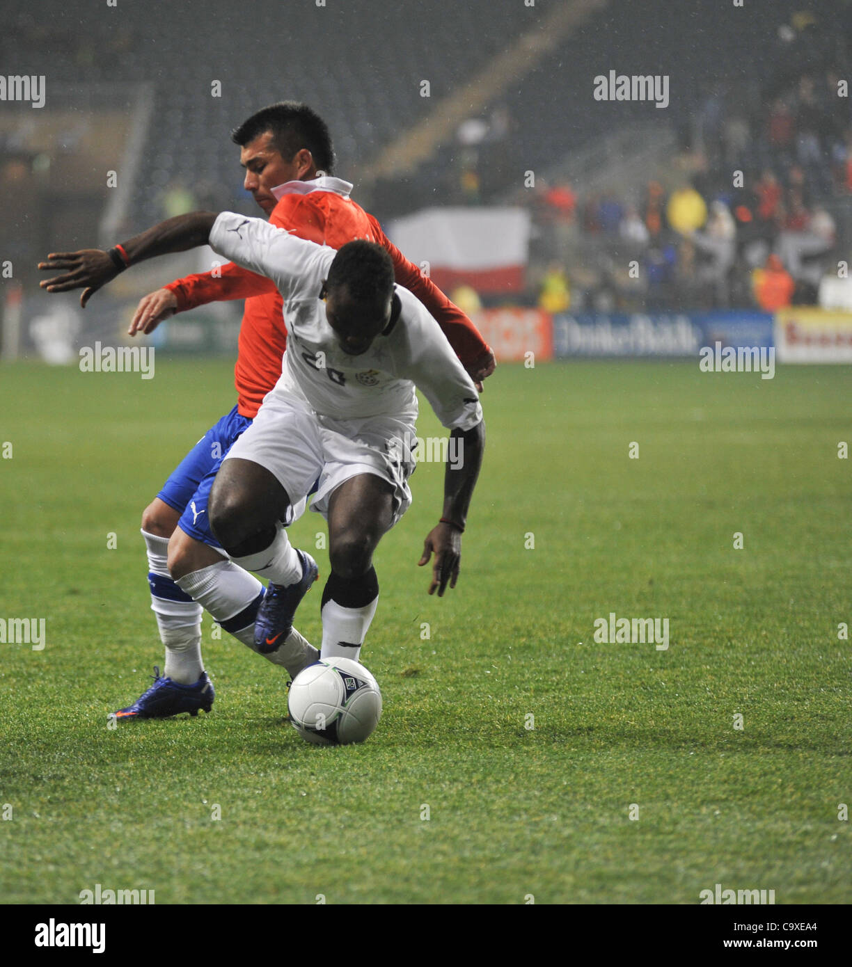 Feb. 29, 2012 - Chester, PA, U.S - Ghanian player, JOHN BOYE, and Chile player, GARY MEDEL, in action during the International Friendly match. The match was played in the rain at PPL Park in Chester Pa and ended in a 1-1 tie. (Credit Image: © Ricky Fitchett/ZUMAPRESS.com) Stock Photo