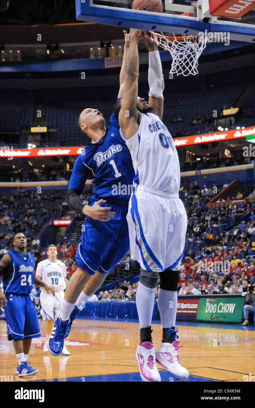 March 2, 2012 - St. Louis, Missouri, United States of America - Creighton's Gregory Echeniquie (00) misses a slam while being defended by Drake's Jordan Clarke (1) during the second round of the State Farm Missouri Valley Conference Men's Basketball Tournament at Scottrade Center, St. Louis, MO. (Cr Stock Photo