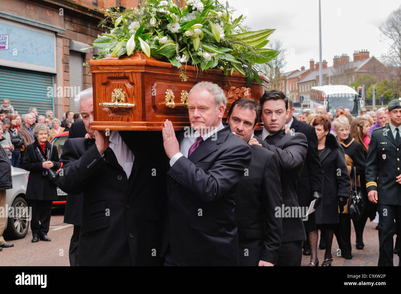Martin McGuinness carries the coffin at the Funeral of Belfast Comedian Frank Carson. BELFAST 03/03/2011 Stock Photo