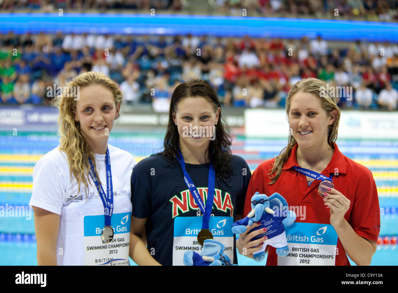 Ellen Gandy (Gold), Francesca Halsall (Silver) & Jemma Lowe (Bronze), medal ceremony for the Womens Open 100m Butterfly - Final, British Swimming Championships 2012, 04 Mar 12, Aquatics Centre, Olympic Park, London, UK. Stock Photo