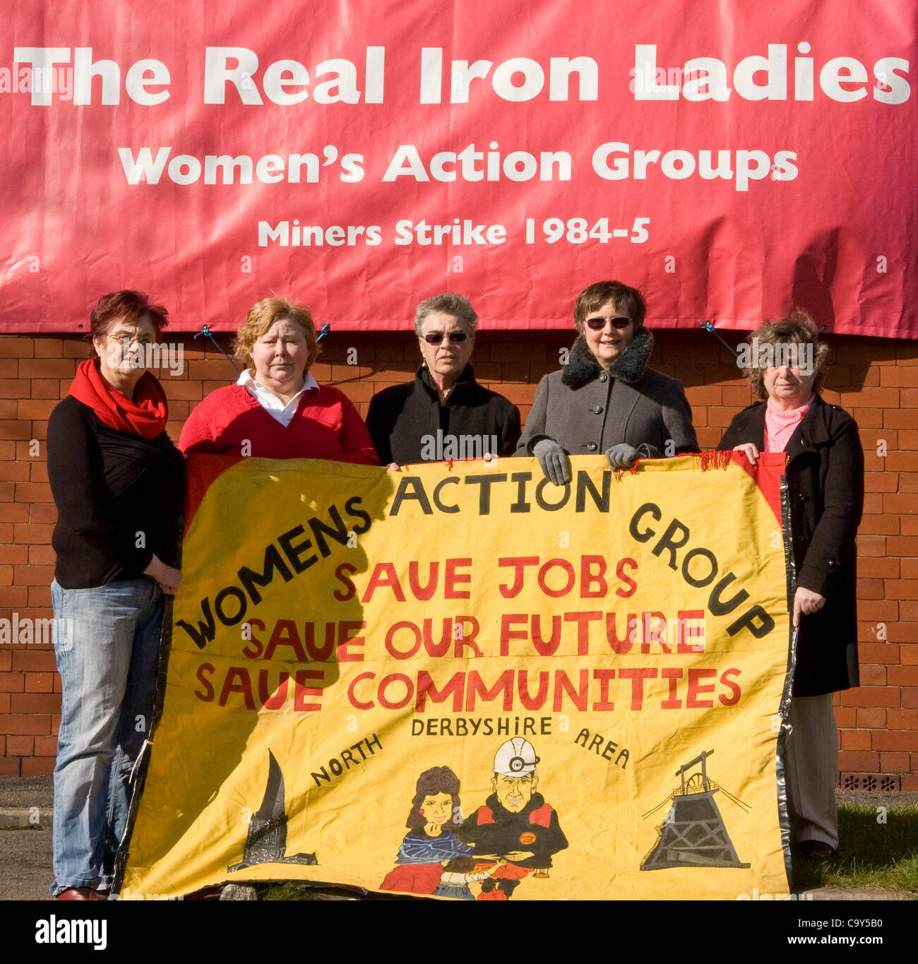 Chesterfield,Derbyshire,UK Real Iron Ladies women's action group (North Derbyshire area) hold a  banner that commemorates their role in the 1984-5 miner's strike, UK Stock Photo