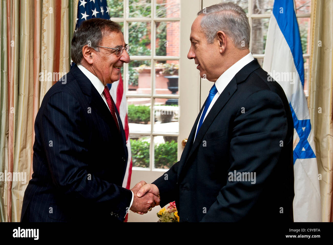Defense Secretary Leon E. Panetta greets  Israeli Prime Minister Benjamin Netanyahu prior to a meeting at Blair House, Washington, D.C., March 5, 2012. Stock Photo
