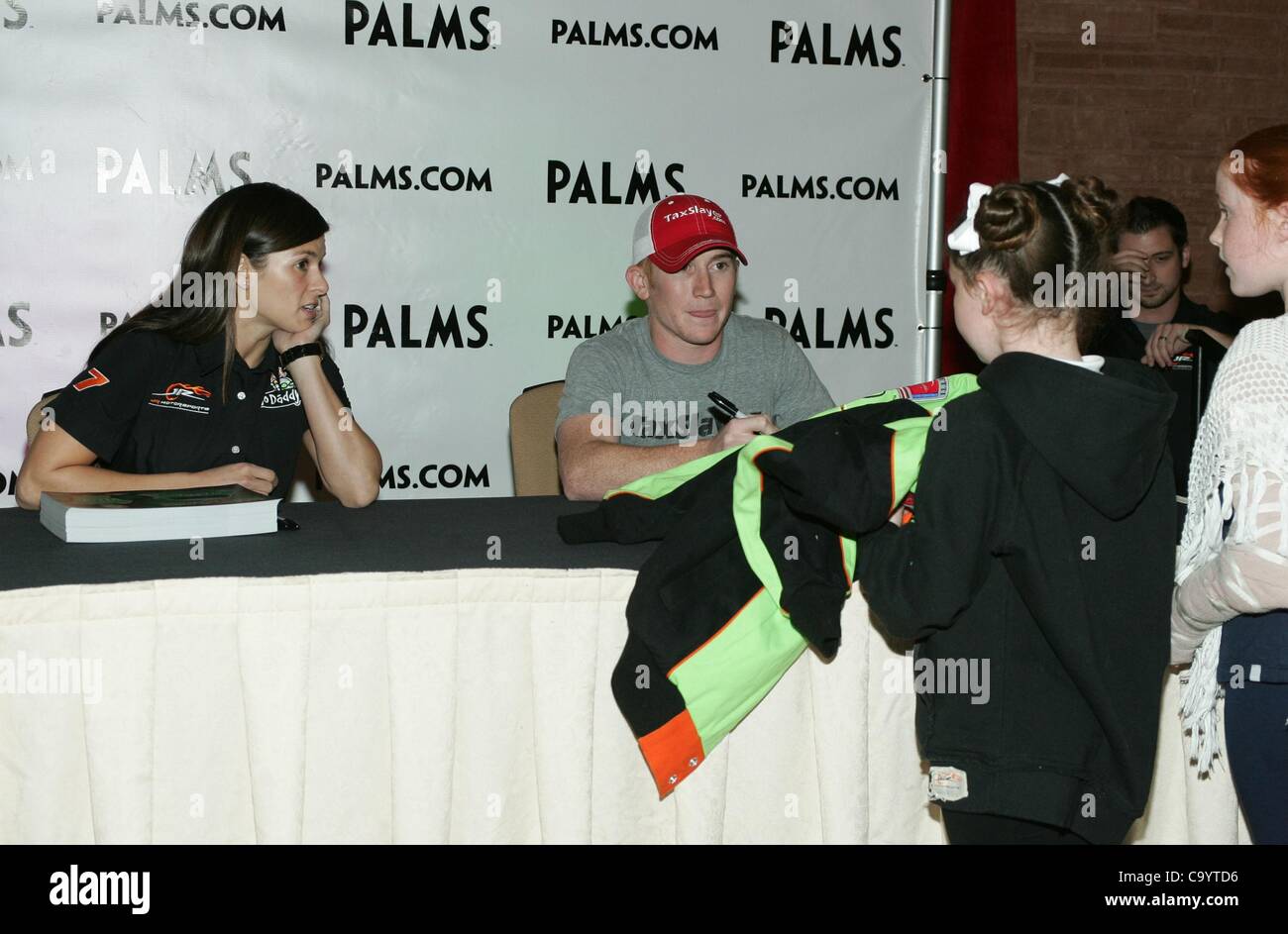 Danica Patrick, Cole Whitt in attendance for JR Motorsports Presents NASCAR Autograph Signing, Palms Casino Resort Hotel, Las Vegas, NV March 9, 2012. Photo By: James Atoa/Everett Collection Stock Photo