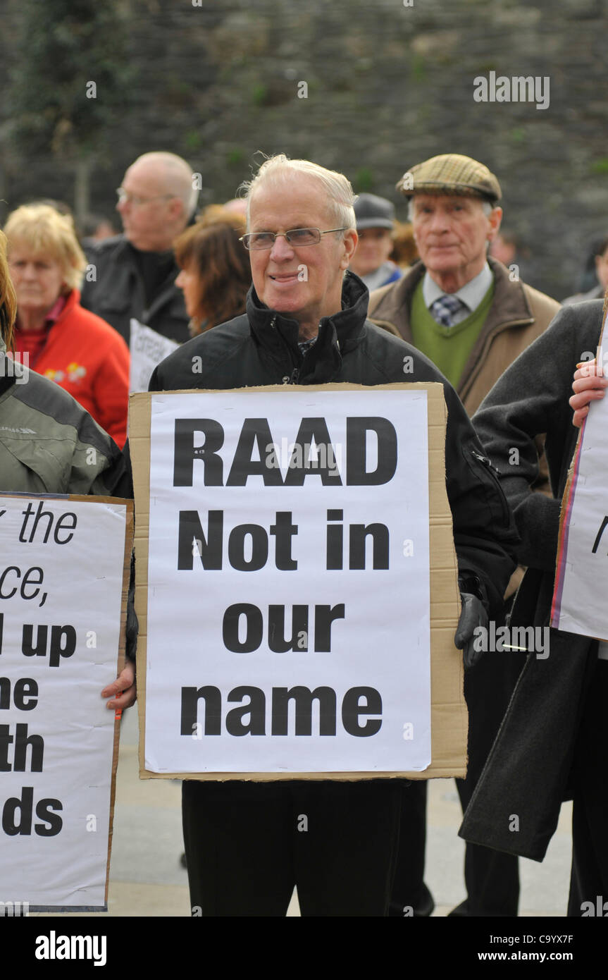 10 March 2012 - Londonderry, Northern Ireland, UK. Protesters with placards at a rally calling for a republican vigilante  group, Republican Action Against Drugs (RAAD) to disband following punishment shootings in the Bogside on Wednesday,  death threats and the killing of a father of two last month Stock Photo
