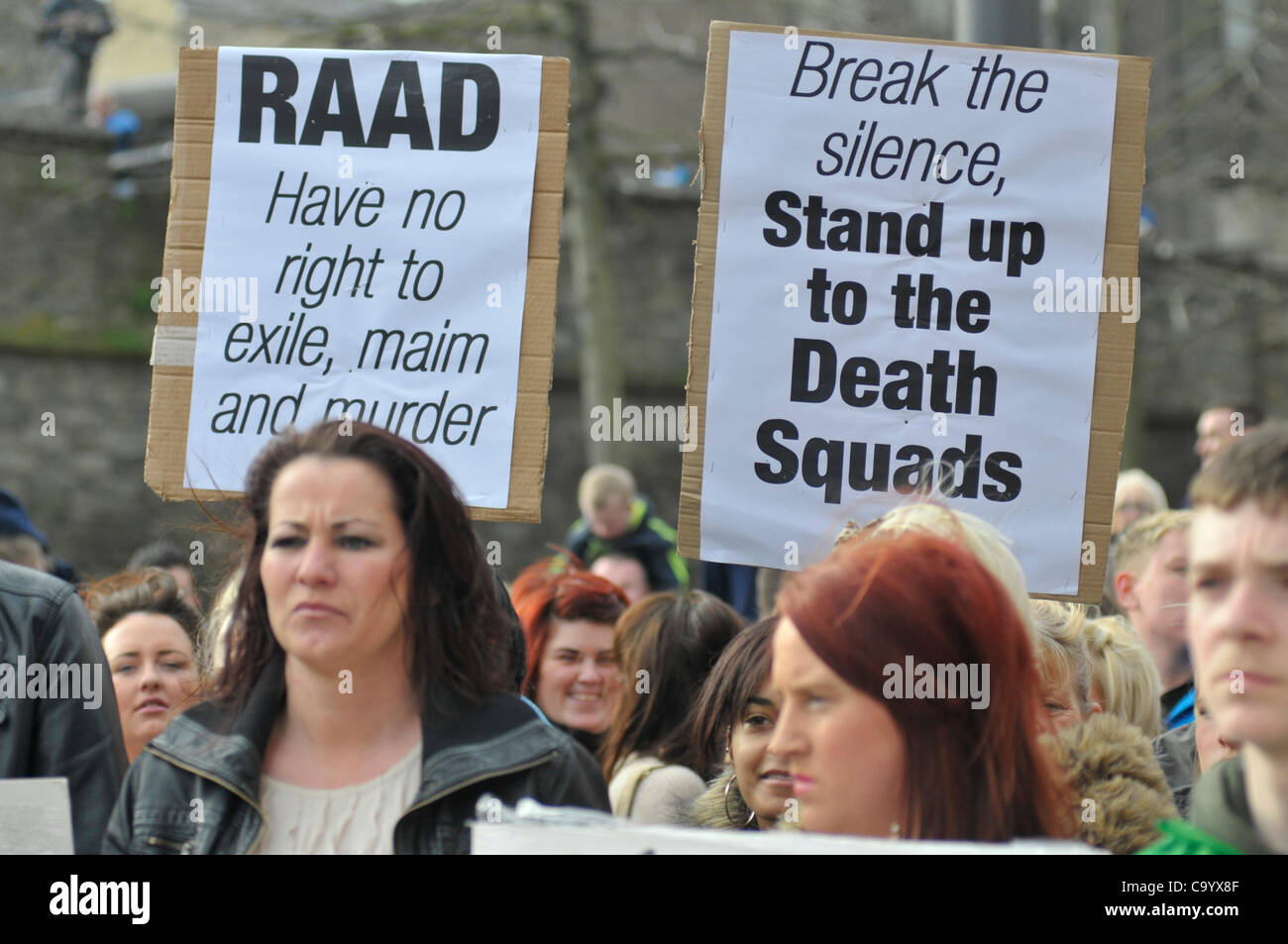 10 March 2012 - Londonderry, Northern Ireland, UK - Protesters with placards at a rally calling for a republican vigilante  group, Republican Action Against Drugs (RAAD) to disband following punishment shootings in the Bogside on Wednesday last,  death threats and the killing of a father of two last Stock Photo