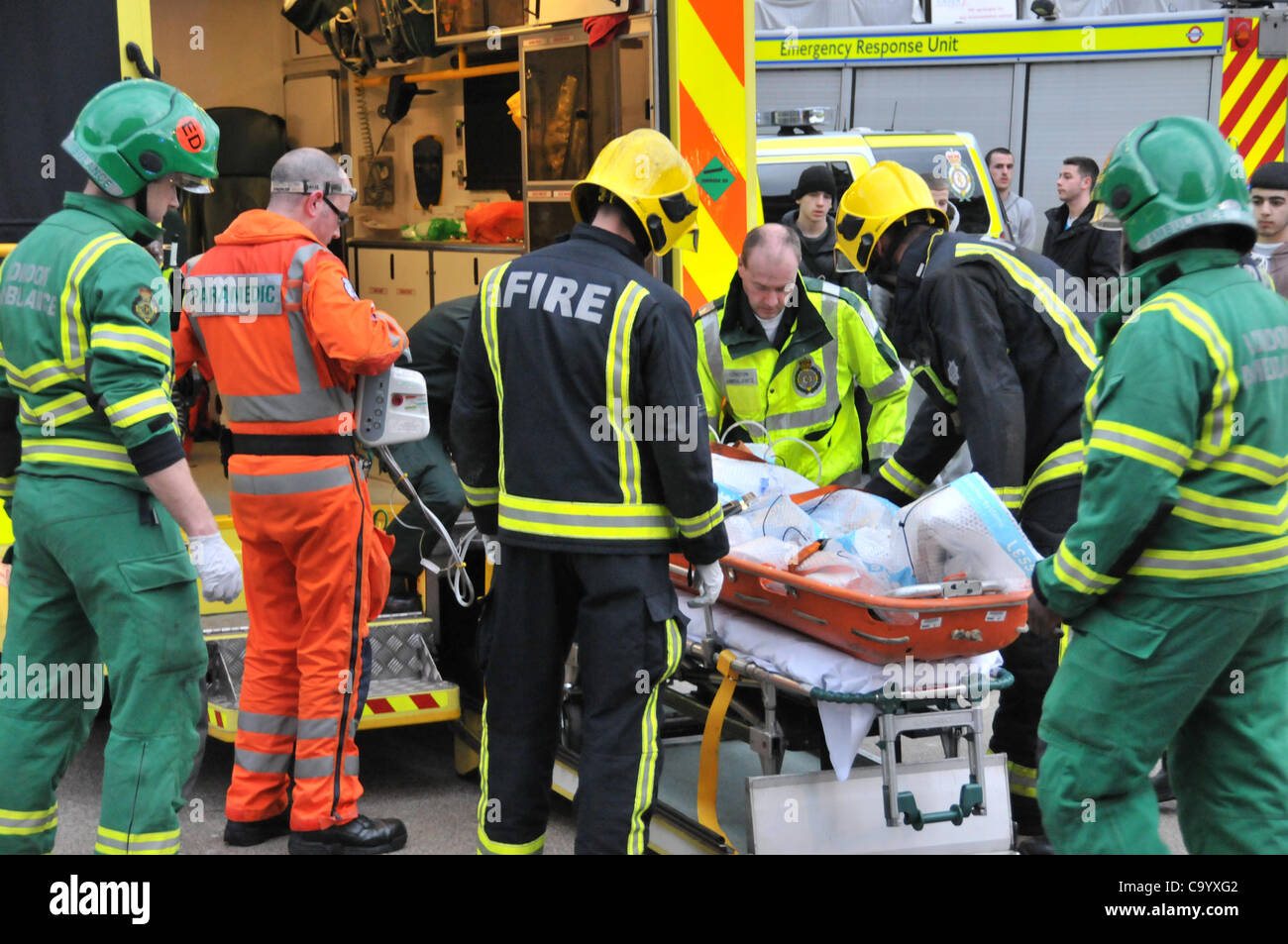 Wood Green London 10/3/12 Person under a train at Wood Green Underground station, paramedics, ambulance staff and police attend the scene as the station is closed to recover the person alive. The injured person is put into the ambulance just after leaving the station. Stock Photo