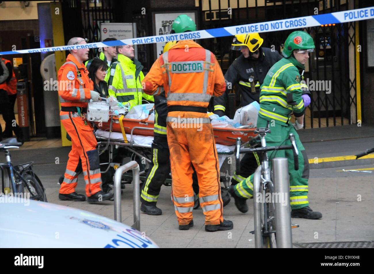 Wood Green London 10/3/12 Person under a train at Wood Green Underground station, paramedics, ambulance staff and police attend the scene as the station is closed to recover the person alive. The injured person is taken from Wood Green station to the ambulance. Stock Photo