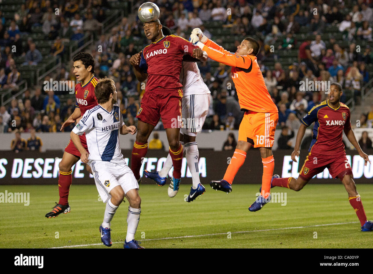 March 10, 2012 - Carson, California, U.S - Real Salt Lake defender Jamison Olave #4 gets a head on a corner kick while Real Salt Lake goalkeeper Nick Rimando #18 tries to punch it away during the Major League Soccer game between Real Salt Lake and the Los Angeles Galaxy at the Home Depot Center. Rea Stock Photo