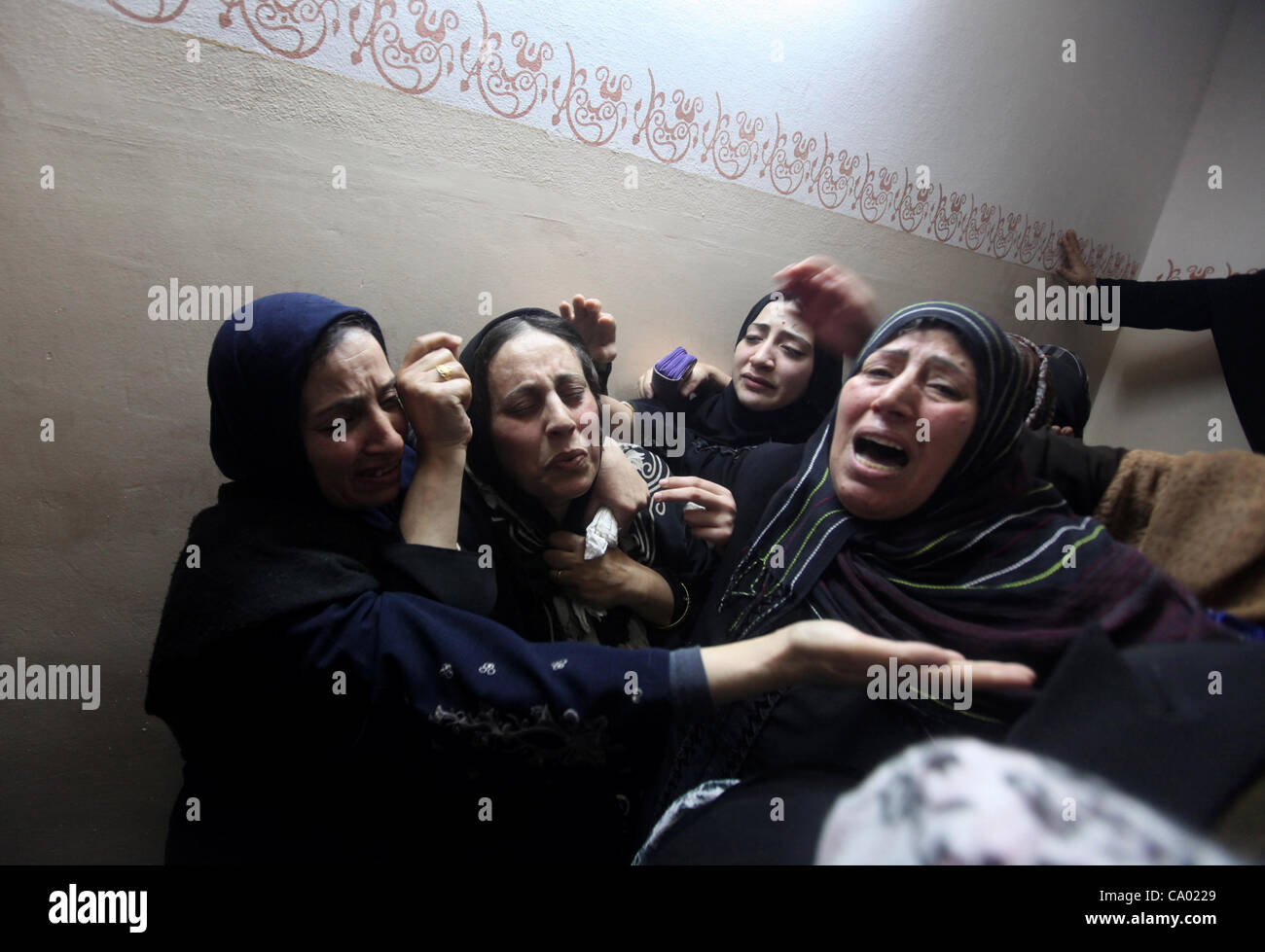 March 11, 2012 - Beit Lahia, Gaza Strip, Palestinian Territory - Palestinian female relatives of Ahmed Salim, one of the Nasser Salahaldin Brigades militants who was killed in an Israeli air strike, grieve during his funeral in Gaza City, on March 11, 2012. Photo by Ashraf Amra (Credit Image: © Ashr Stock Photo