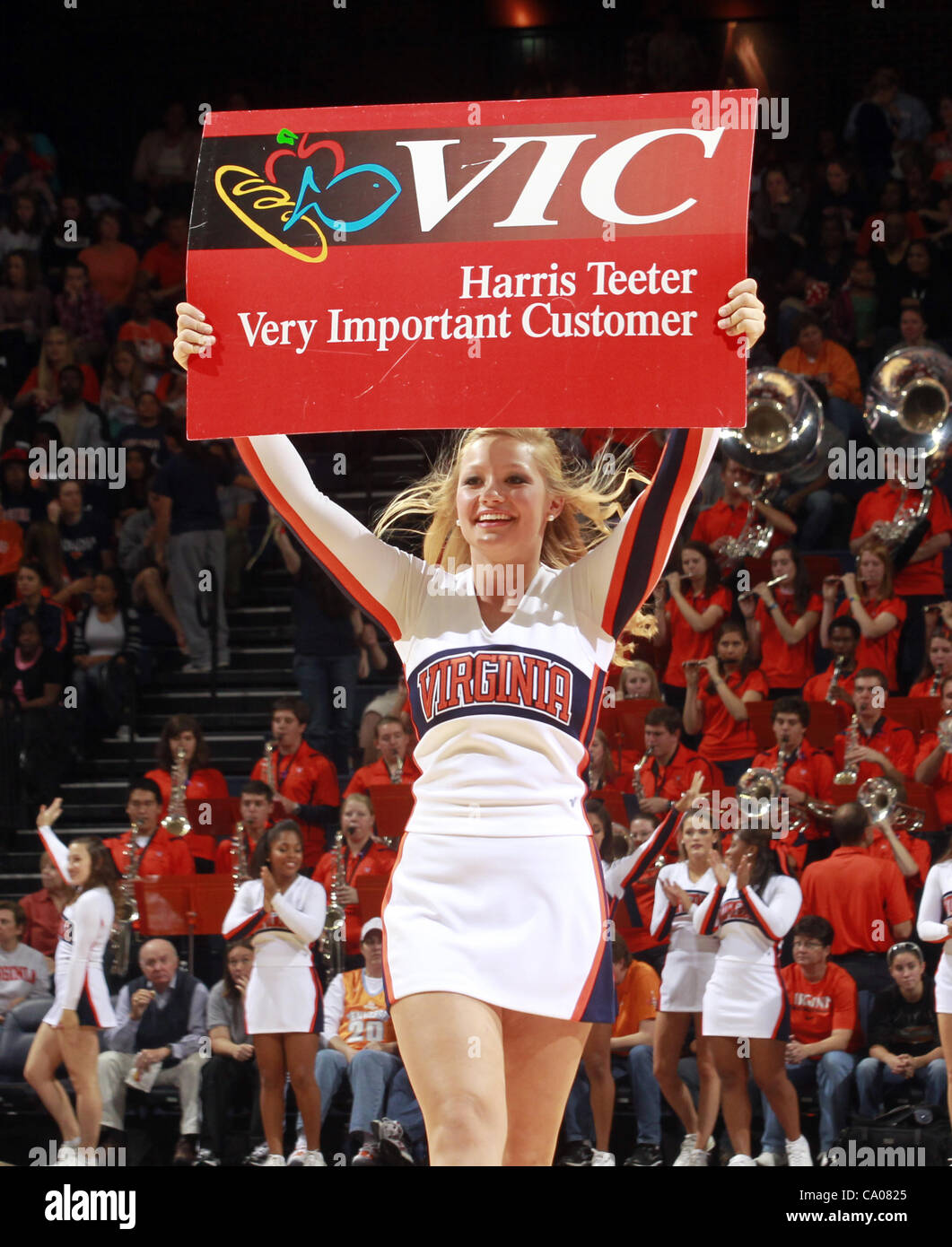 Nov. 20, 2011 - Charlottesville, Virginia, United States - Virginia Cavaliers cheerleaders hold up a Harris Teeter Vic card sign during the game on November 20, 2011 against the Tennessee Lady Volunteers at the John Paul Jones Arena in Charlottesville, Virginia. Virginia defeated Tennessee in overti Stock Photo