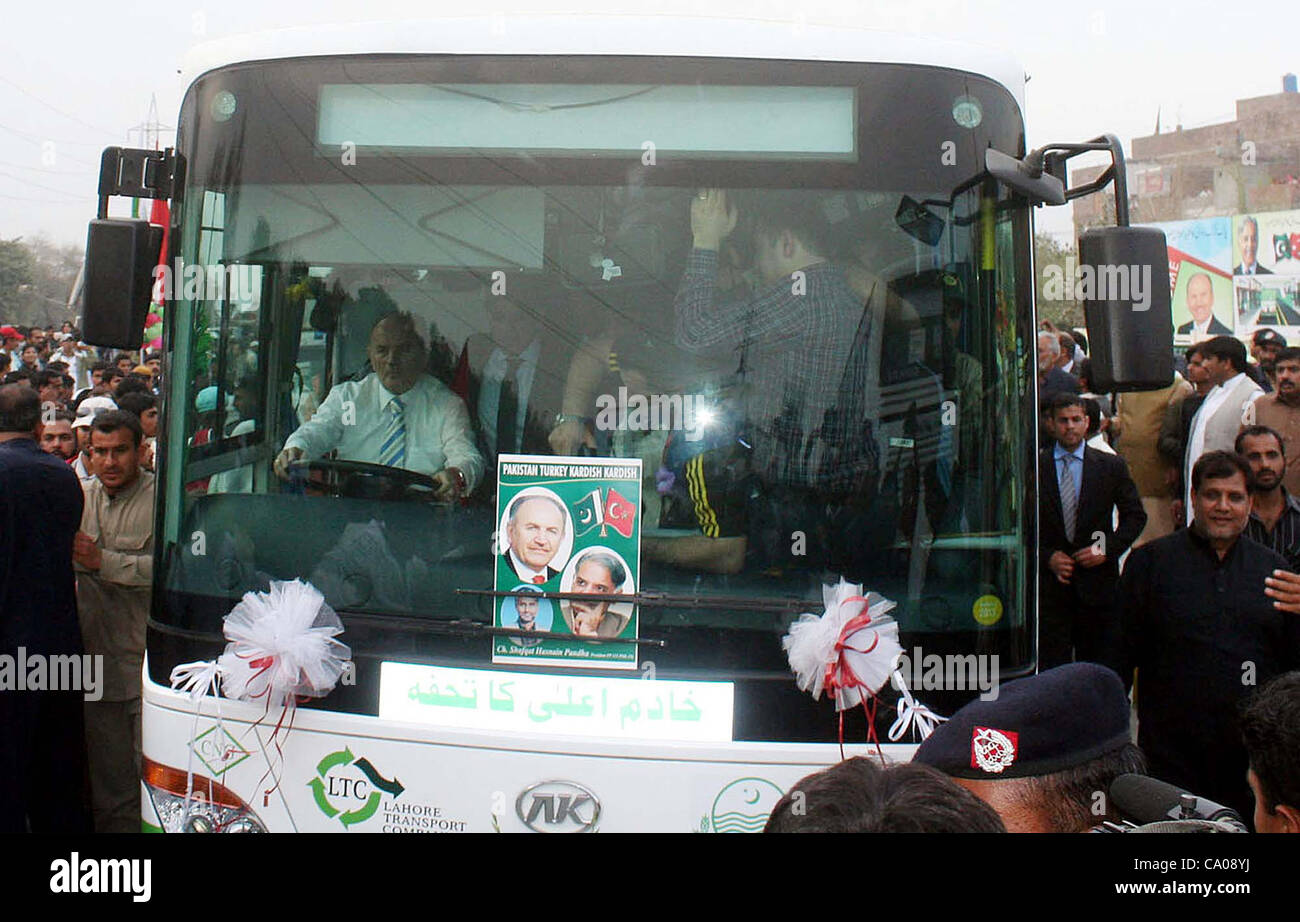 Punjab Chief Minister, Shahbaz Sharif along with Turkey Mayor, Dr.Kadir Topbas sit inside a bus on the occasion of inauguration  ceremony of Lahore Transport Company (LTC) bus service held in Lahore on Monday, March 12, 2012. Stock Photo