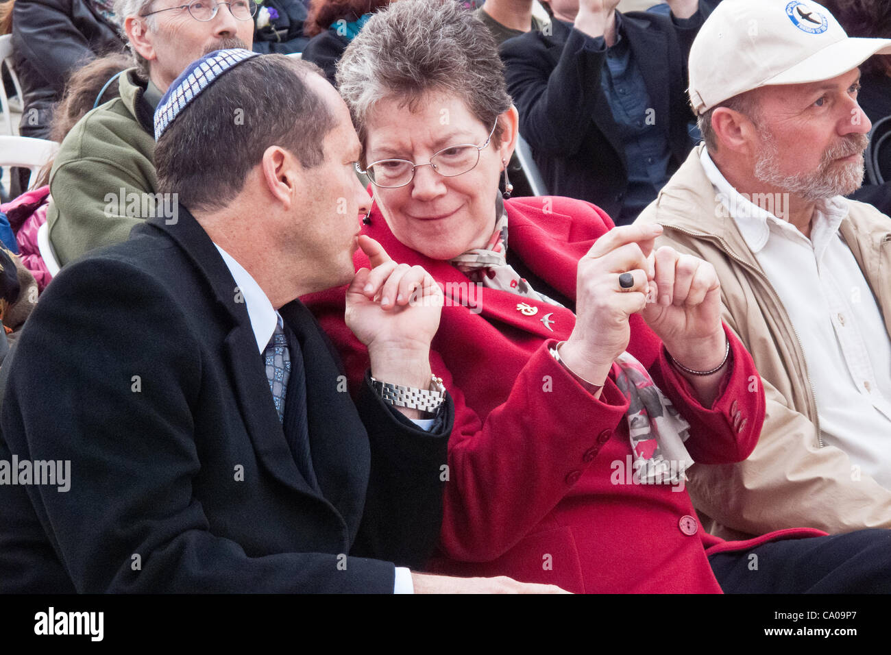 Jerusalem Mayor Mr. Nir Barkat  and Deputy Mayor Ms. Naomi Tsur exchange words at a welcoming ceremony for thousands of swifts returning from South Africa to nest in the Western Wall as spring and breeding season arrive. Jerusalem, Israel. 12-Mar-2012. Stock Photo