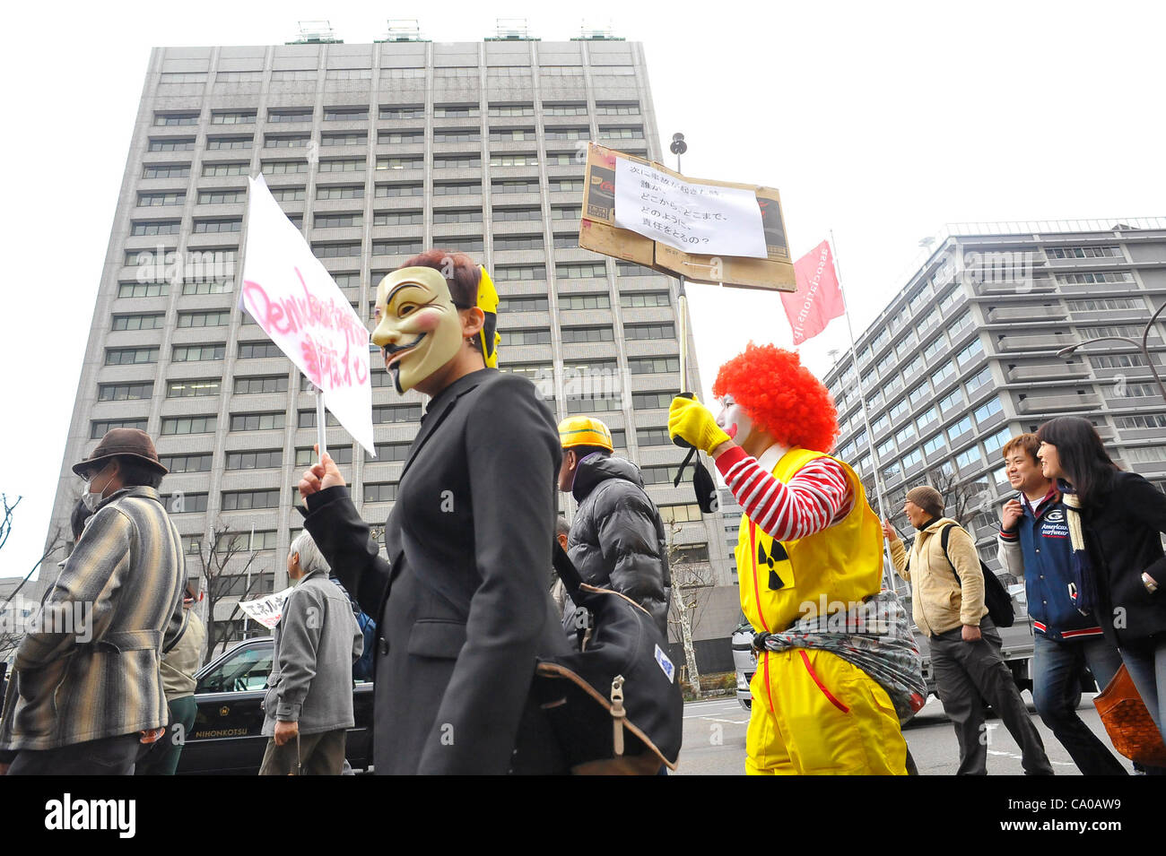 Tokyo, Japan - March 11: Hundreds of thousands of people walked in front of the building of Ministry of Economy, Trade and Industry during a demonstration against nuclear power plants at Chiyoda, Tokyo, Japan on March 11, 2012. As this day was one year anniversary of Great East Japan Earthquake and  Stock Photo