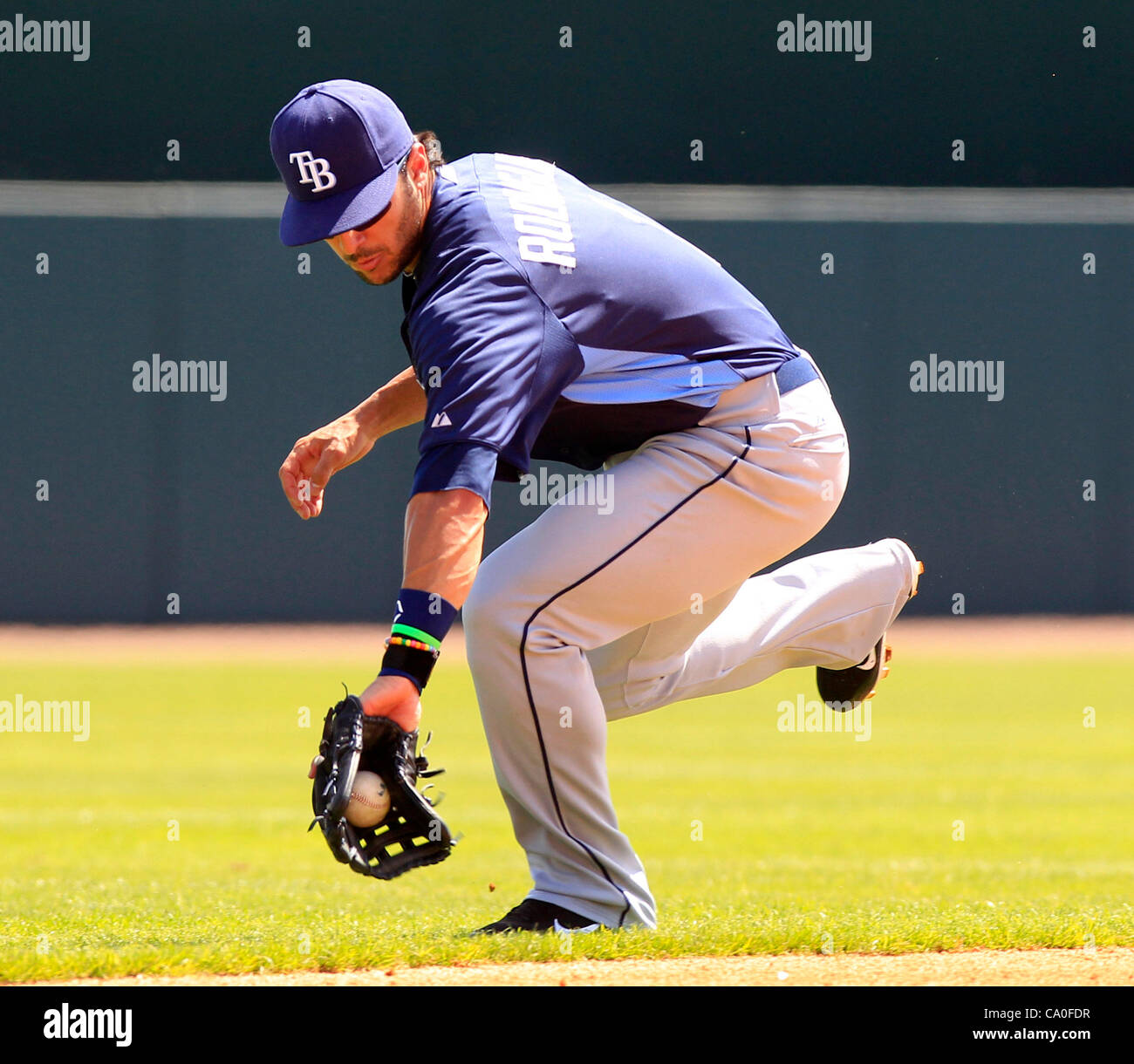 March 13, 2012 - Sarasota, FL, USA - JAMES BORCHUCK  |   Times.OT 350843 BORC rays (03/12/12) (Sarasota, FL)  Sean Rodriguez fields a Ronny Paulino grounder for an out in the fourth during the Rays spring training game against the Baltimore Orioles at Ed Smith Stadium in Sarasota Tuesday, March 13,  Stock Photo