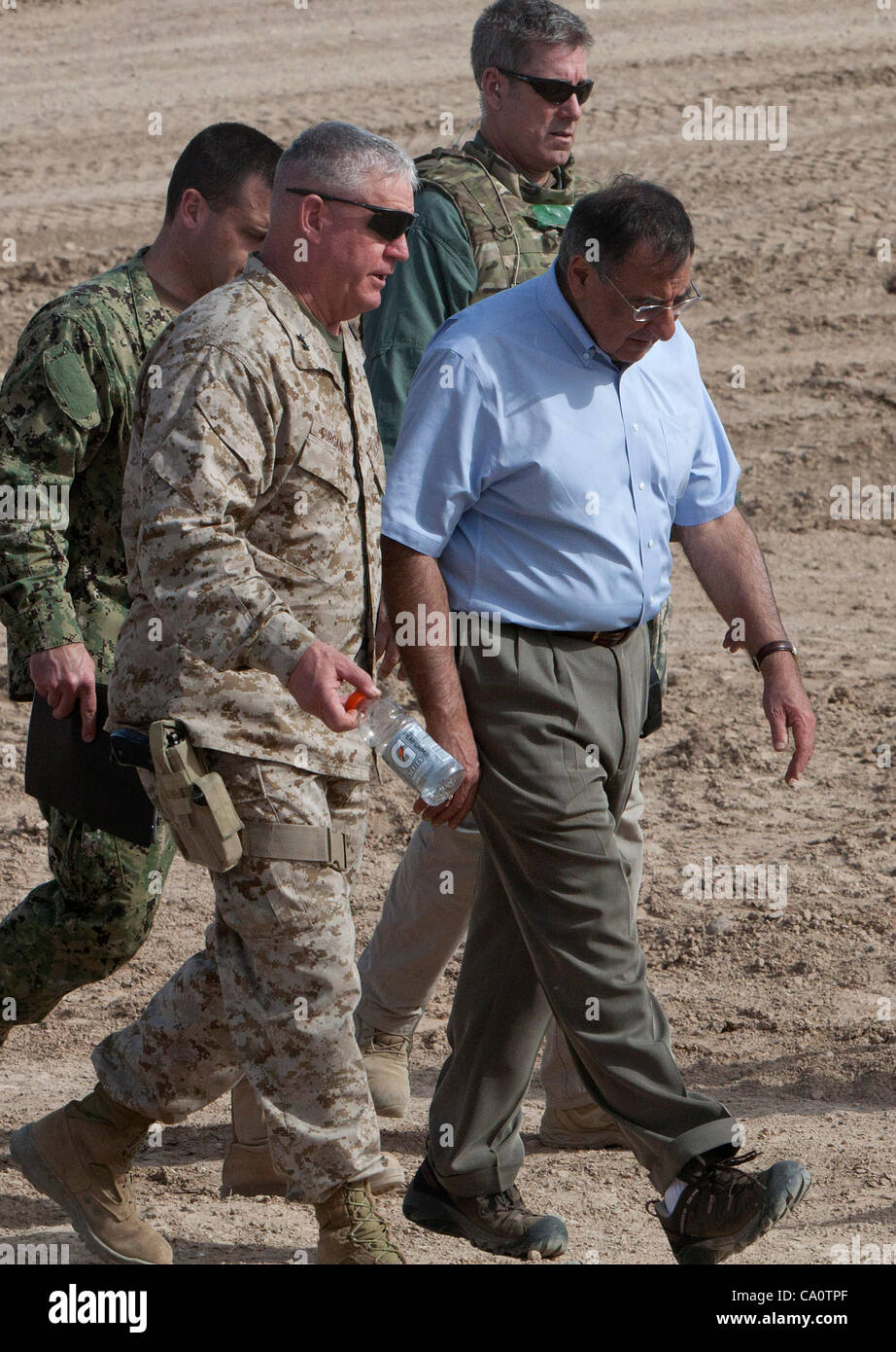 US Secretary of Defense Leon Panetta, right, talks to US Marine Corps Maj. Gen. Charles M. Gurganus, front, the commanding general of Regional Command Southwest at Forward Operating Base Shukvani during his visit March 14, 2012 in Afghanistan. Stock Photo