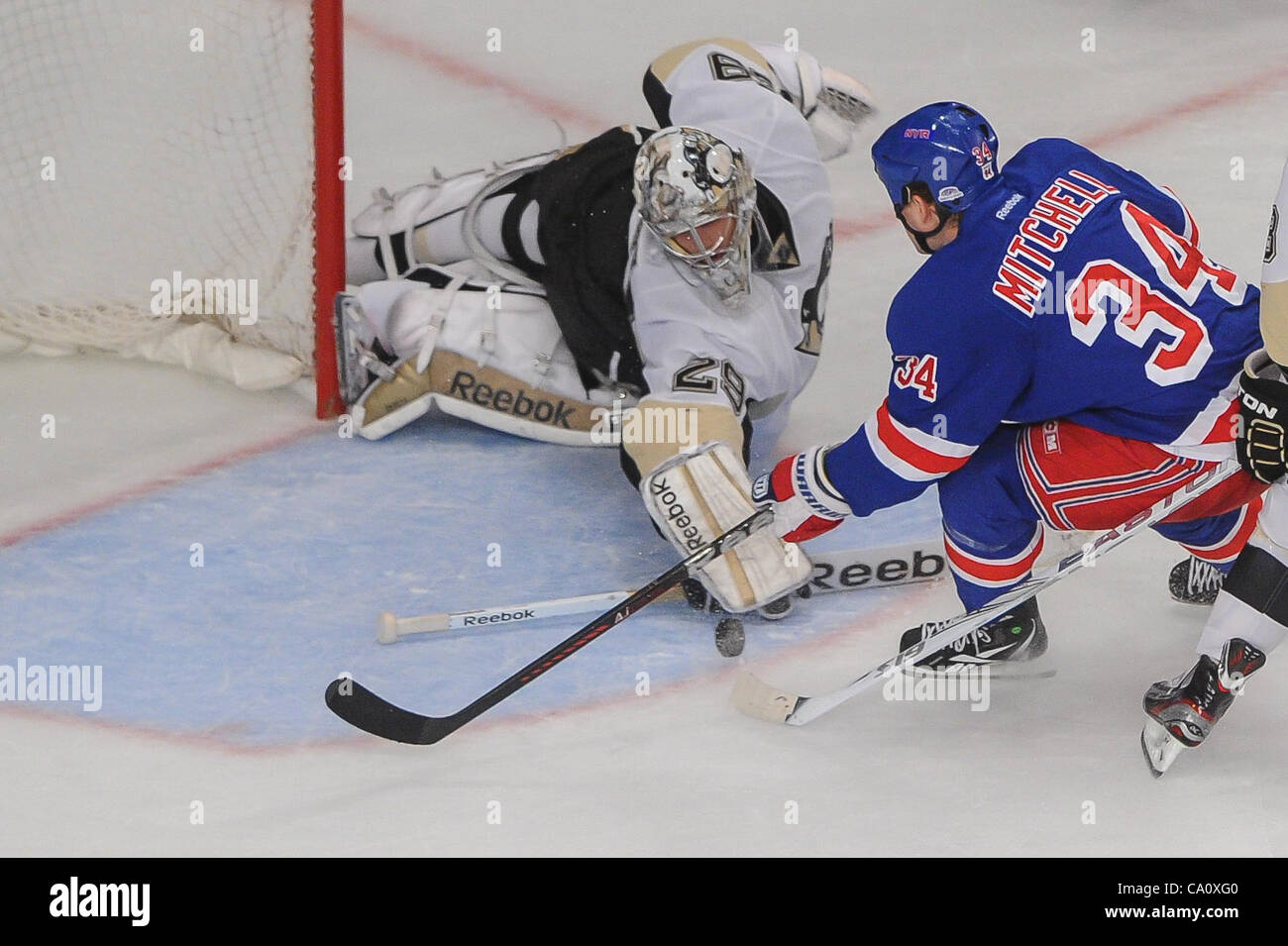 Mar. 15, 2012 - New York, New York, U.S - Pittsburgh Penguins goalie Marc-Andre Fleury (29) makes a spawning save on New York Rangers center John Mitchell (34) during third period NHL action between the Pittsburgh Penguins and the New York Rangers at Madison Square Garden in New York, N.Y. (Credit I Stock Photo