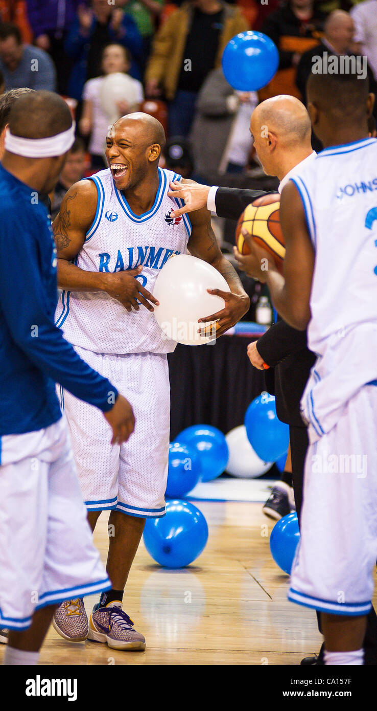 HALIFAX, NS - March 16, 2012: Taliek Brown (centre) and the Halifax Rainmen celebrate after defeating the Quebec Kebs 106-95 in the decisive third game of their best-of-three National Basketball League of Canada semi-final playoff series at the Halifax Metro Centre. With the victory, the Rainmen adv Stock Photo