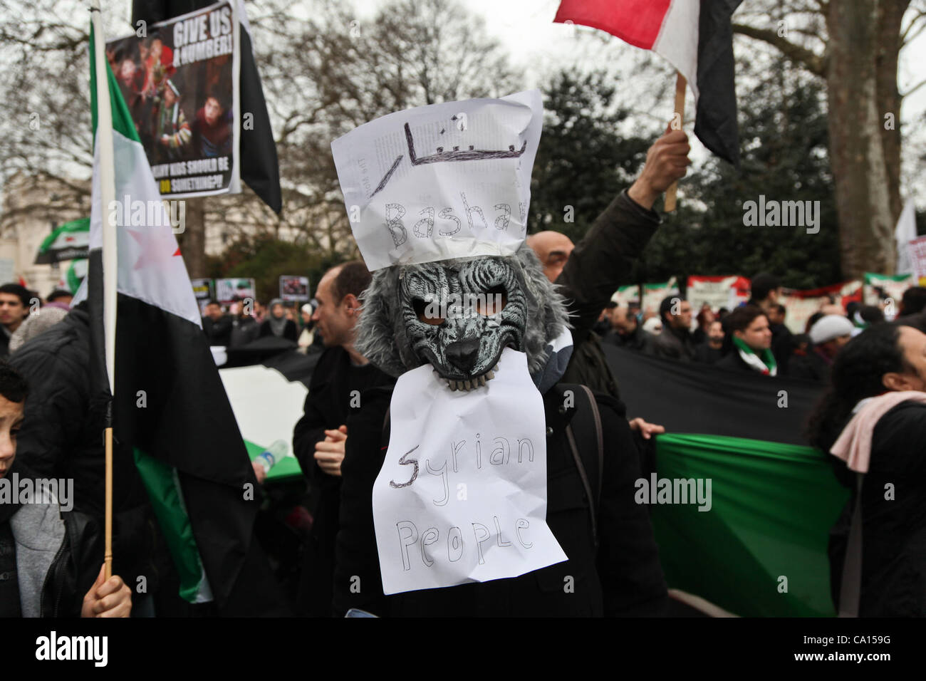 LONDON, UK, 17th March 2012. A demonstrator wears a costume of a wolf symbolizing Al Assad. Hundreds of Syrians marched from Paddington Green to their embassy with flags and placards on the anniversary of the uprising to protest against the ruling Assad regime Stock Photo