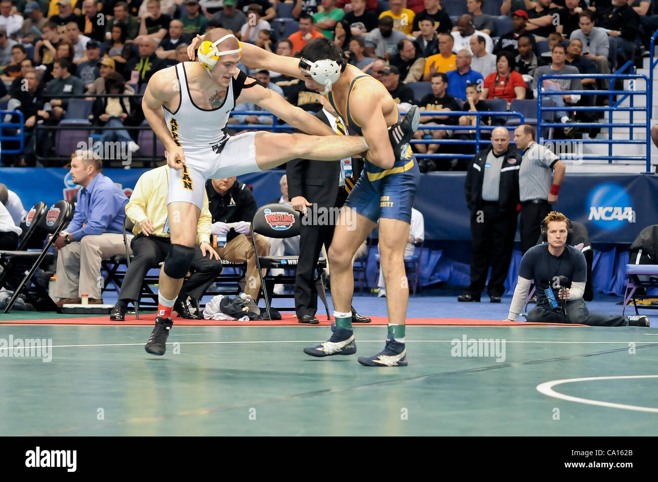 March 17, 2012 - St. Louis, Missouri, United States of America - Bekzod Abdurakhmonov (right) of Clarion uses a single leg brace to control his opponent Kyle Blevins (left) of Appalachian State during the 165 pound 3rd place championship match of the NCAA Division 1 Wrestling Championships in St. Lo Stock Photo