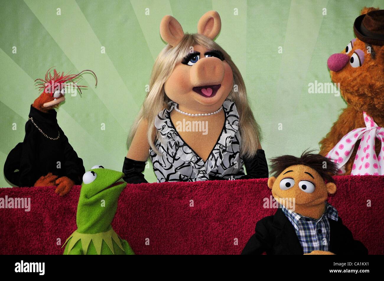 Pepe, Miss Piggy, Kermit, Walter, Fozzie at the induction ceremony for Star on the Hollywood Walk of Fame forThe Muppets, Hollywood Boulevard, Los Angeles, CA March 20, 2012. Photo By: Michael Germana/Everett Collection Stock Photo