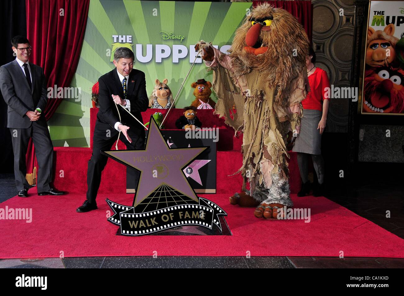 Rich Ross, Leron Gubler, Miss Piggy, Kermit, Walter, Fozzie, Sweetums at the induction ceremony for Star on the Hollywood Walk of Fame forThe Muppets, Hollywood Boulevard, Los Angeles, CA March 20, 2012. Photo By: Michael Germana/Everett Collection Stock Photo