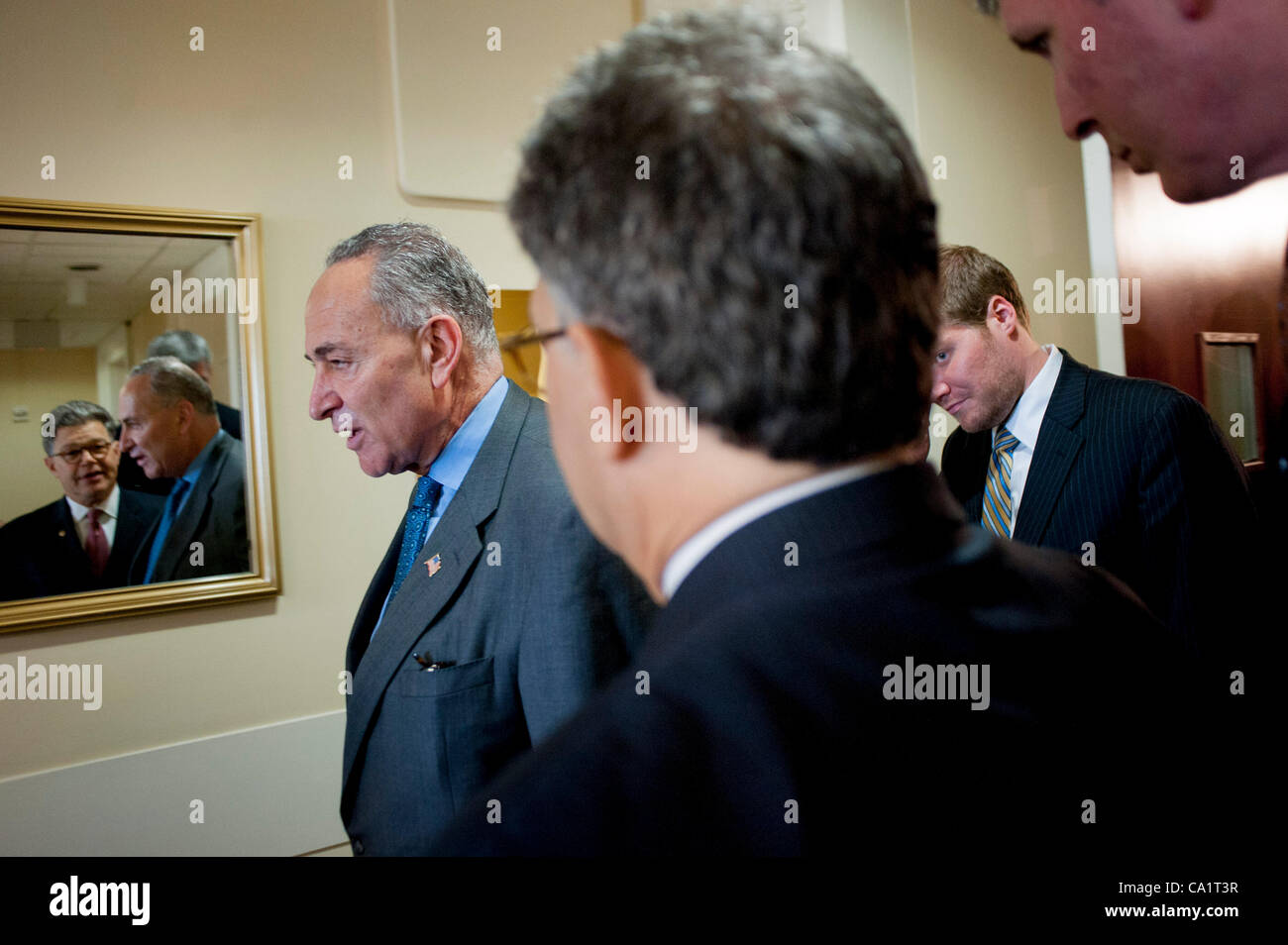 March 21, 2012 - Washington, District of Columbia, U.S. - Senate Rules and Administration Chairman CHUCK SCHUMER (D-NY) confers with Senator AL FRANKEN (D-MN) following a news conference on Capitol Hill Wednesday to announce new legislation ''to blunt the worst effects'' of the Supreme Court's Citiz Stock Photo
