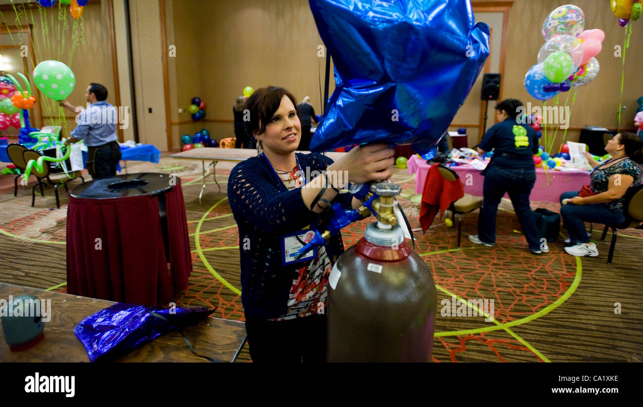 Dallas, Texas, US. Mar 21, 2012. Tammy Bessette of Party Town in Woonsocket, RI, is one of dozens of people taking the test to become a certified balloon artist during the biennial World Balloon Convention at the Sheraton Dallas Hotel. Approx. 700 balloon artist delegates and competitors from 46 cou Stock Photo