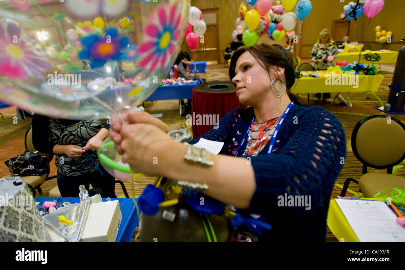 Dallas, Texas, US. Mar 21, 2012. Tammy Bessette of Party Town in Woonsocket, RI, is one of dozens of people taking test to become a certified balloon artist during biennial World Balloon Convention at the Sheraton Dallas Hotel. Approx. 700 balloon artist delegates and competitors from 46 countries a Stock Photo
