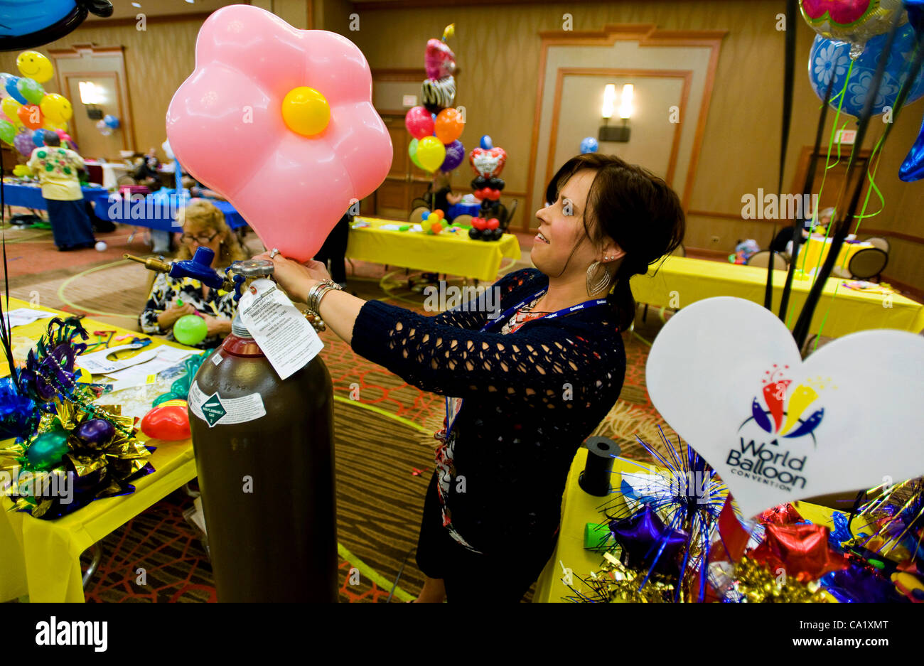 Dallas, Texas, US. Mar 21, 2012. Tammy Bessette of Party Town in Woonsocket, RI, is one of dozens of people taking test to become certified balloon artist during biennial World Balloon Convention at Sheraton Dallas Hotel. Approx. 700 balloon artist delegates and competitors from 46 countries attend. Stock Photo