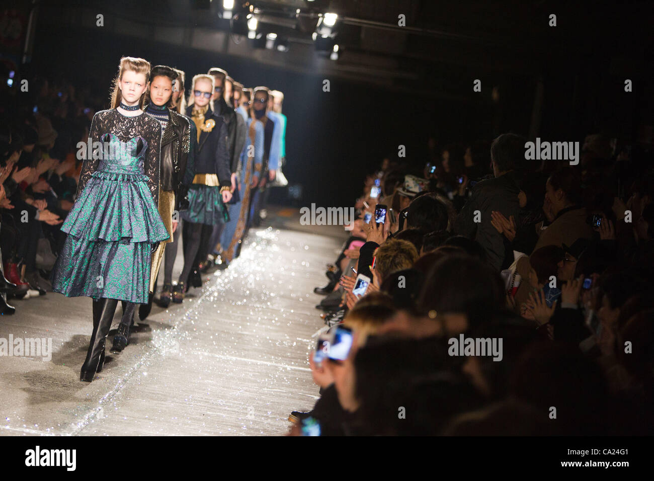 March 23, 2012, Tokyo, Japan - Models walk down the catwalk wearing 