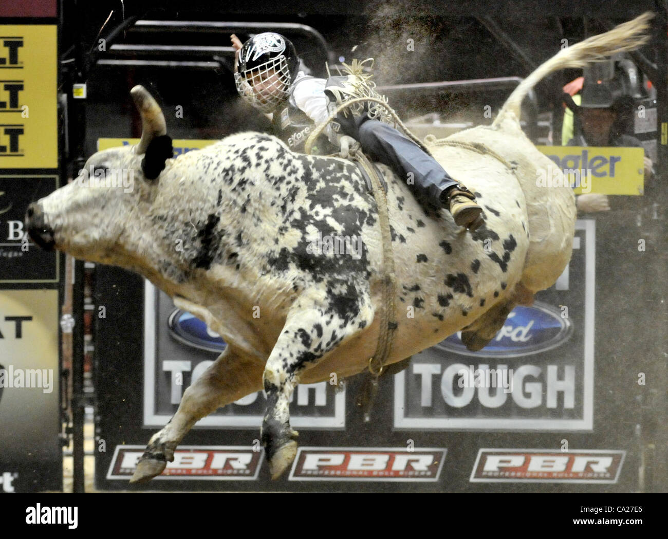 March 23, 2012 - Albuquerque, NM, U.S. - Greg Sorber  --  Cord McCoy starts to slip off the  back of the bull, Ludacris, at the PBR Ty Murray Invitational in the Pit in Albuquerque on Friday, March 23, 2012. (Credit Image: © Greg Sorber/Albuquerque Journal/ZUMAPRESS.com) Stock Photo