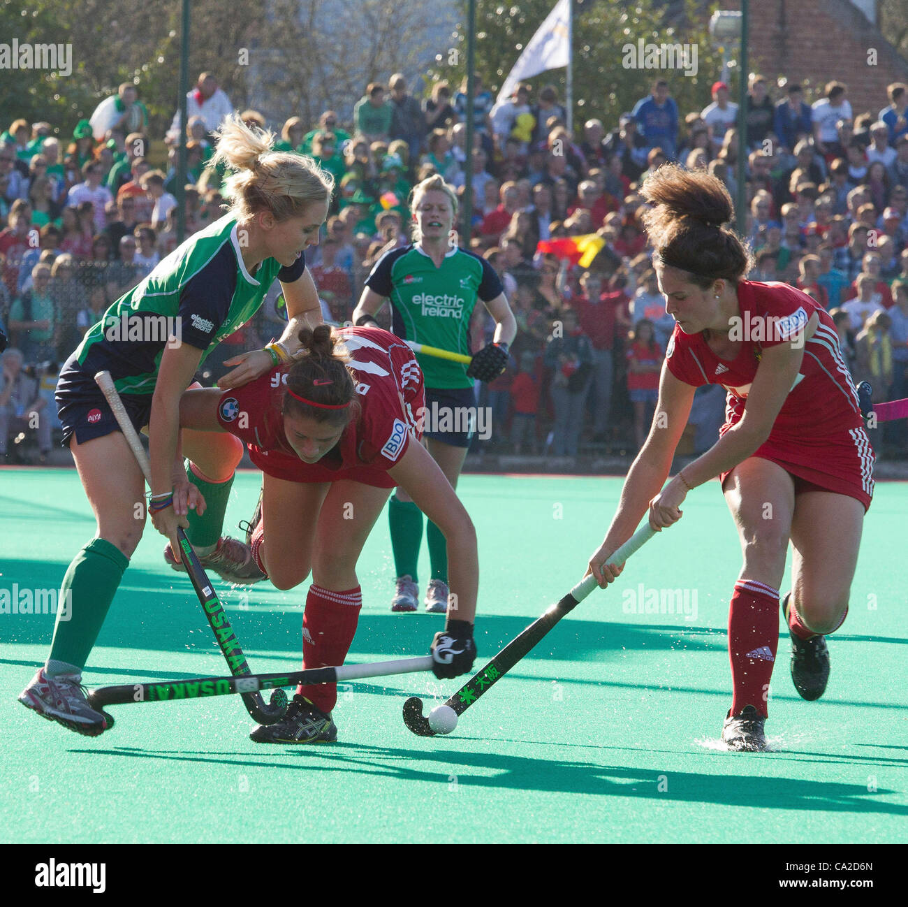25.03.2012 - Kontich, Belgium - Pictured at the final of the Womens Hockey Olympic Qualifying Tournament between Ireland and Belgium. A tussle for the ball between Irelands Nicola Daly and Stephanie De Groof and Anouk Raes of Belgium. Stock Photo