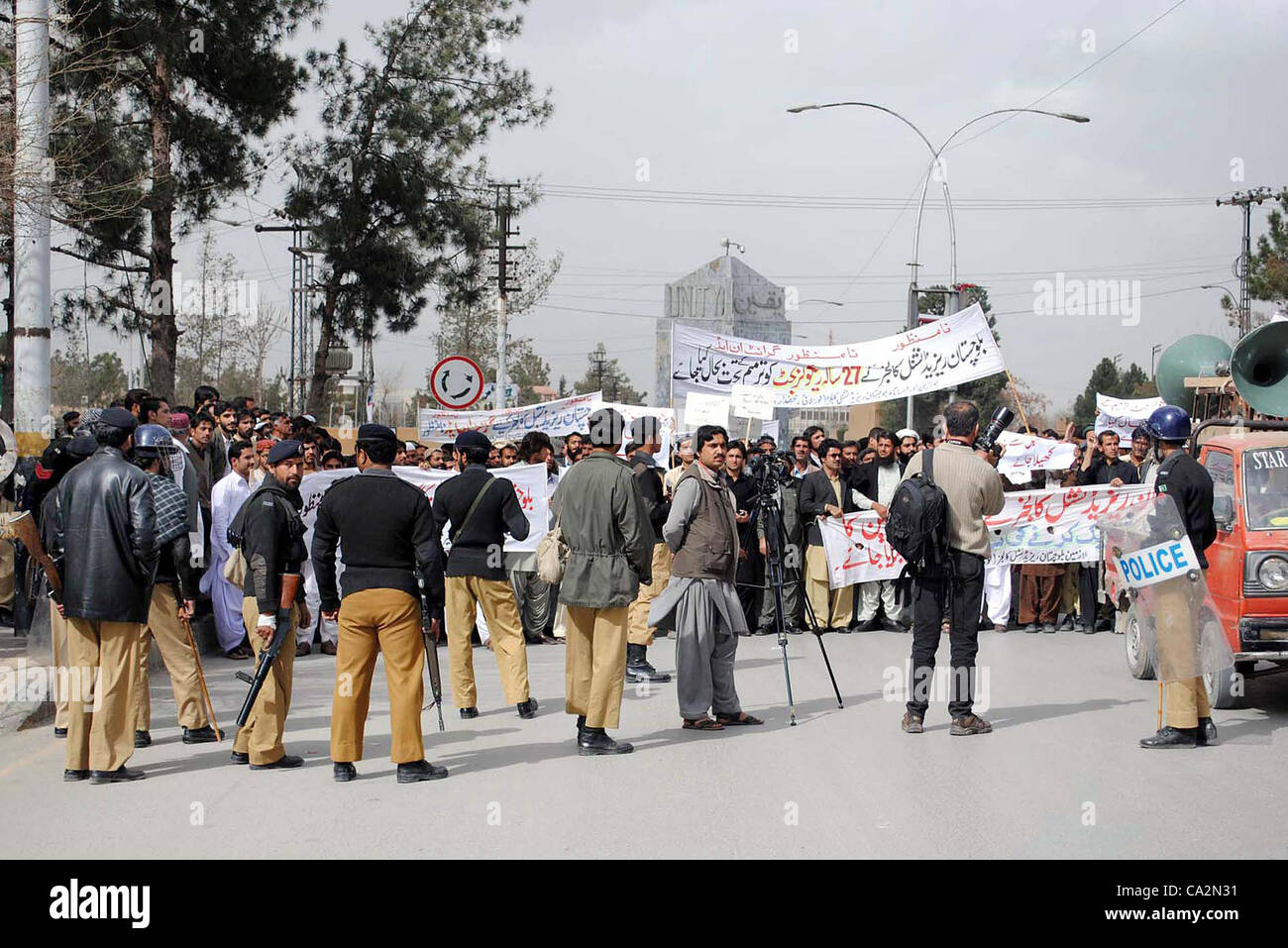 Policemen stand guard during protest demonstration of Balochistan ...
