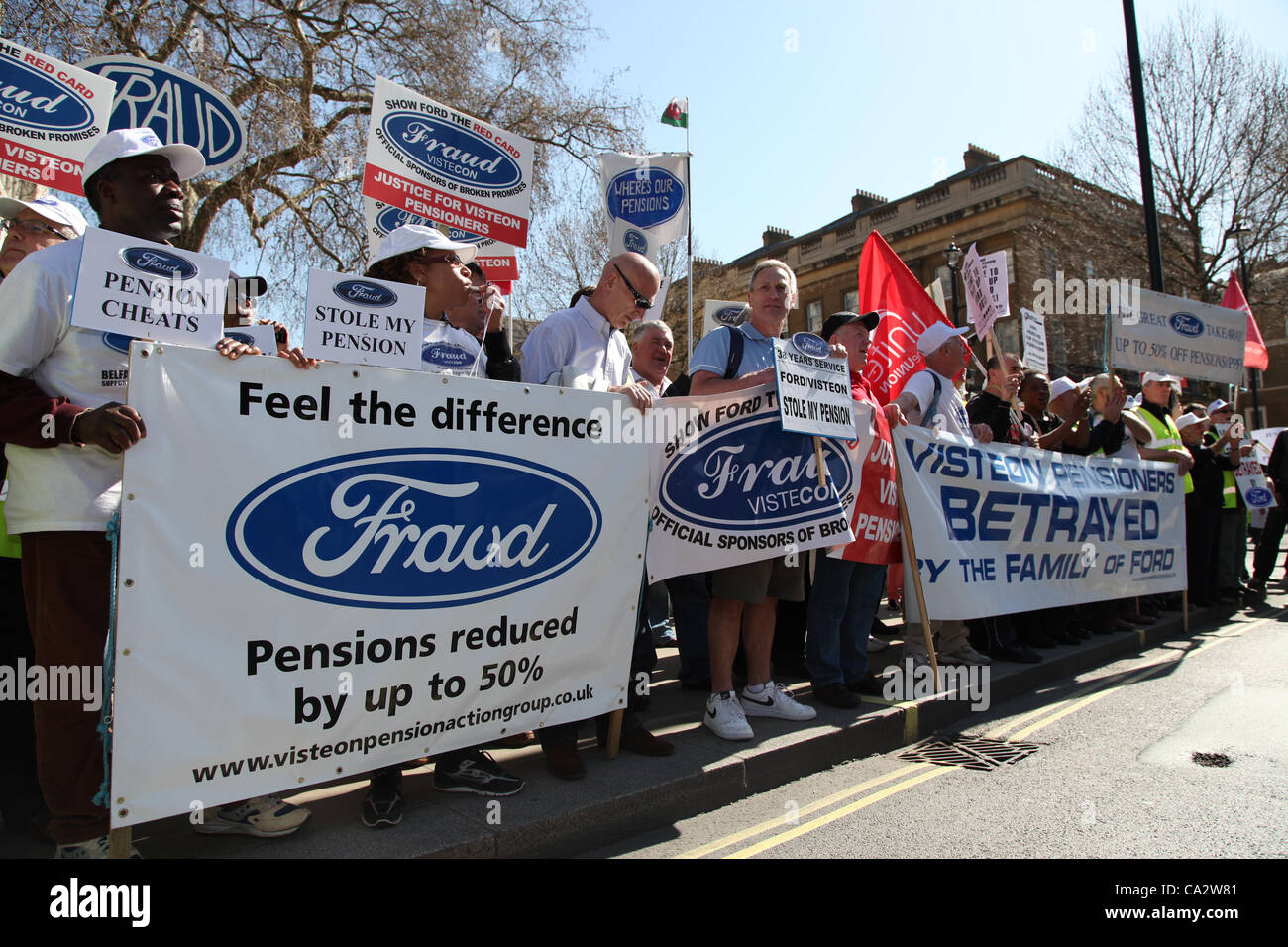 LONDON, UK, 28th Mar, 2012. Workers from Ford protest opposite Downing Street before joining the main NUT march. Thousand of teachers and lecturers gathered in Malet Street before marching to Westminster to protest against the government’s plans for public sector pensions. Stock Photo