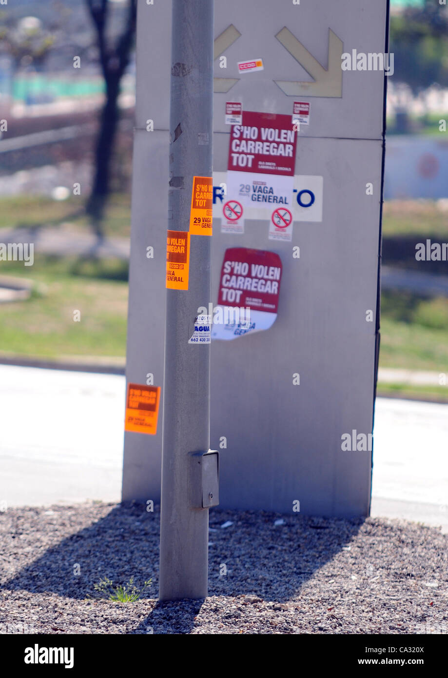General Strike in Spain (March 29th, 2012).  Stickers with the legend in catalan 'S'ho volen carregar tot' (They want to get rid of everything, in reference to the restriction of social gains achieved by the workers) anywhere where they could be sticked. Stock Photo