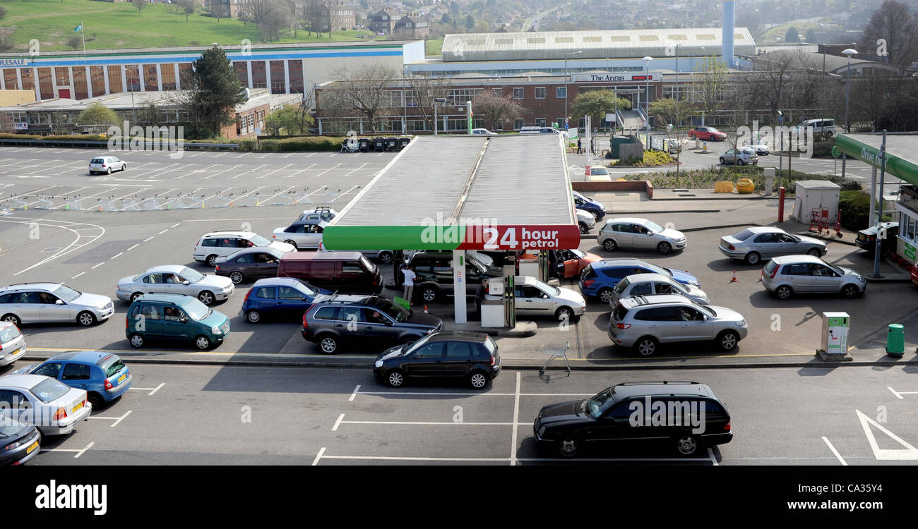 Friday 30th March 2012. Hollingbury, Brighton, UK Asda staff guide traffic into the petrol forecourt today during fuel panic UK Stock Photo