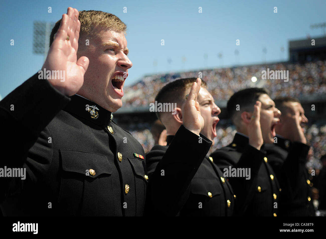 Midshipmen take the oath of service during the 2012 US Naval Academy graduation and commissioning ceremony May 29, 2012 in Annapolis, MD. Stock Photo