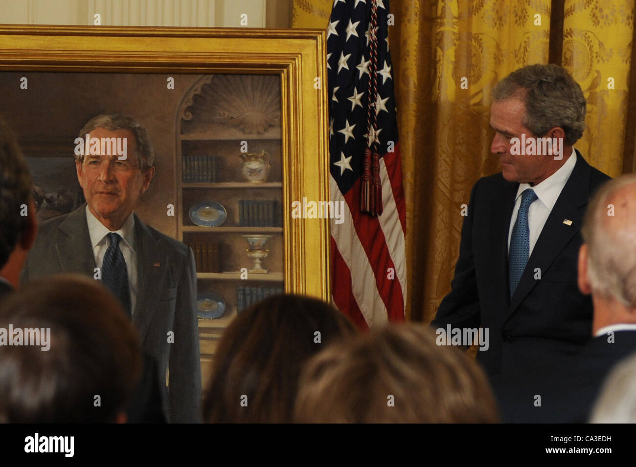 May 31, 2012 - Washington, District of Columbia, U.S. - Former President GEORGE W. BUSH stood next to his official portrait during a ceremony in the East Room of the White House on Thursday. (Credit Image: © Christy Bowe/Globe Photos/ZUMAPRESS.com) Stock Photo