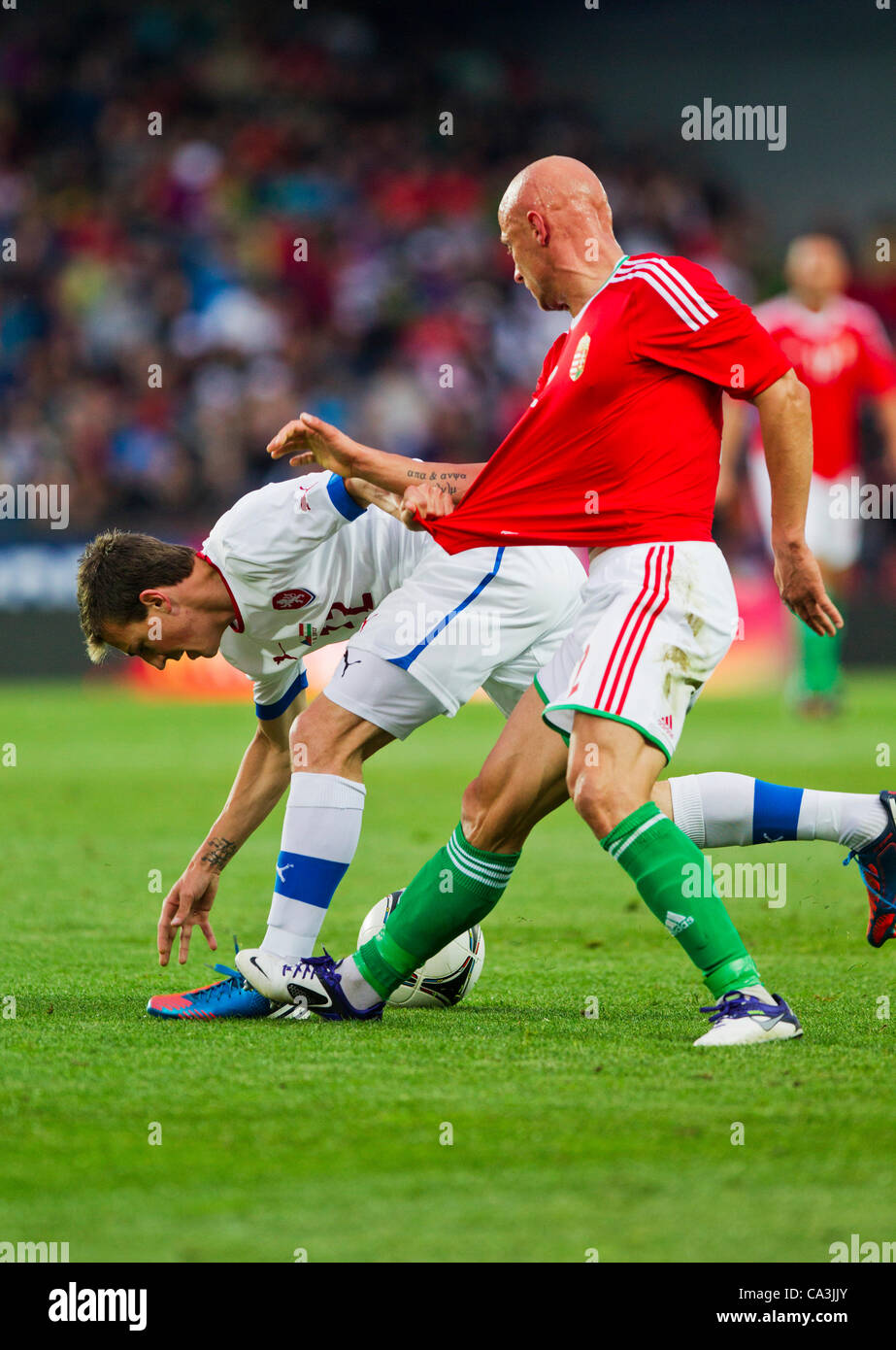 Vladimir Darida of Czech Republic (left) challenges for the ball with Jozsef Varga of Hungary during their friendly match in Prague, Generali Arena, on Friday, June 1st, 2012. (CTK Photo/Rene Fluger) Stock Photo