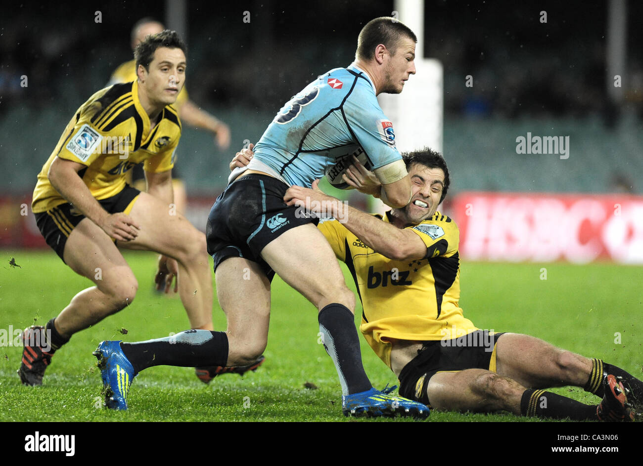 02.06.2012 Sydney, Australia. Hurricanes midfielder and captain Conrad Smith tackles Waratahs centre Rob Horne during the FxPro Super Rugby game between the Waratahs  and the Hurricanes at the Allianz Stadium,Sydney. Stock Photo