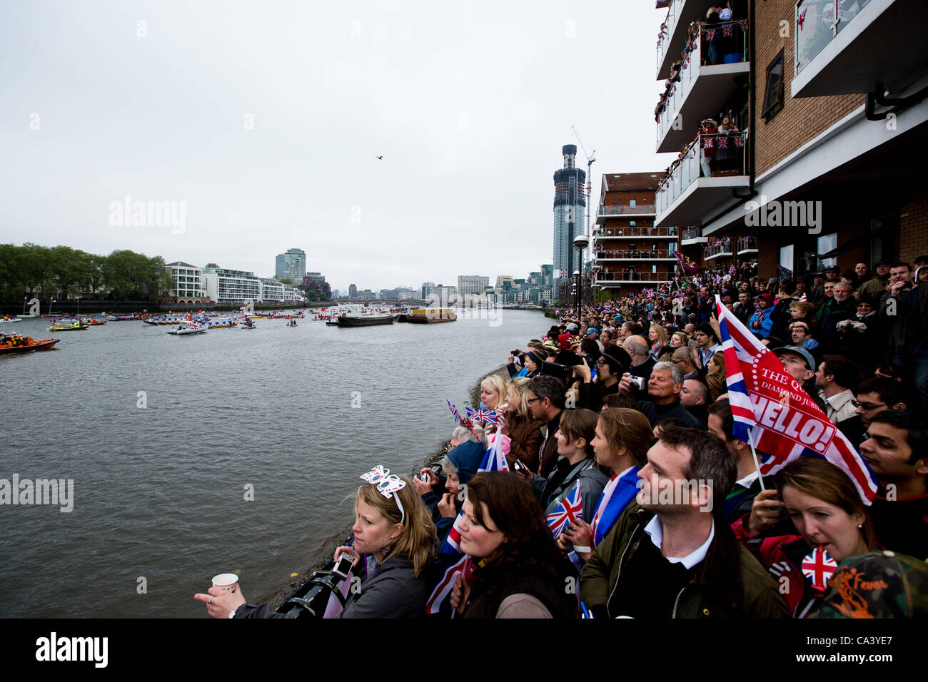 LONDON, UK, 3rd June 2012. Spectators watch as the pageant sails by. Stock Photo