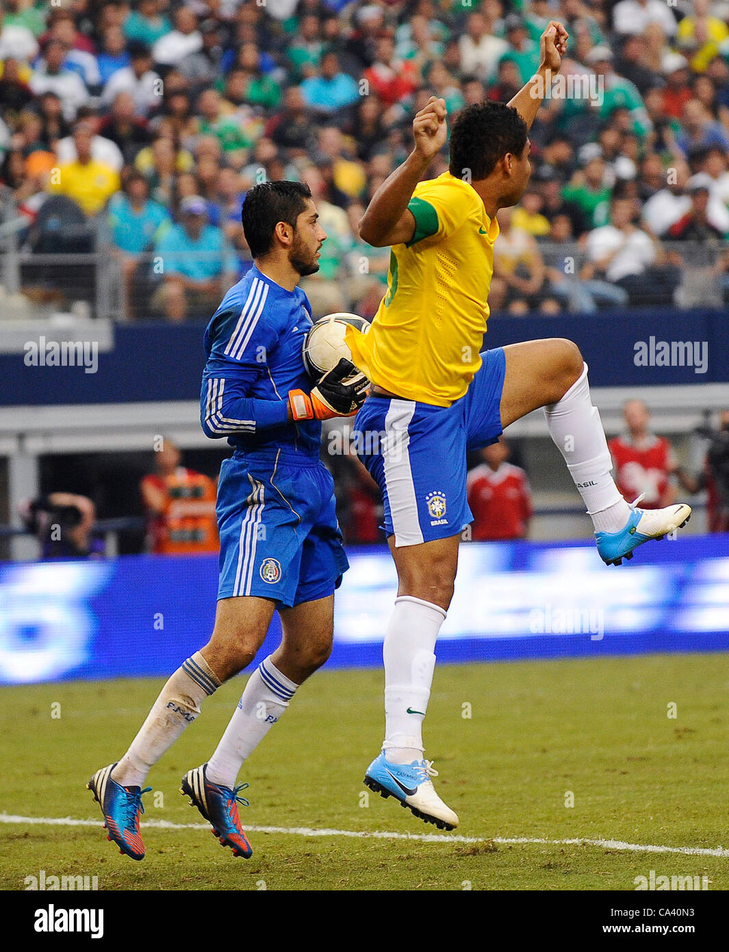 June 3, 2012 - Arlington, Texas, USA - June 3, 2012. Arlington, Texas, USA. Goalkeeper Jesus Corona of Mexico defends against Casimiro (15) of Brazil in the second half as the Brazilian National soccer team played the Mexican National soccer team at Cowboys Stadium in Arlington, Texas. Mexico defeat Stock Photo