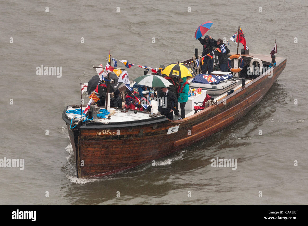 The New Britannic, a Dunkirk Little Ship proceeds along River Thames, as part of the Queen’s Thames Diamond Jubilee Pageant, taken from Tower Bridge, London, UK, 3rd June 2012. The Diamond Jubilee celebrates Queen Elizabeth the second’s 60 years as Head of the Commonwealth. Stock Photo