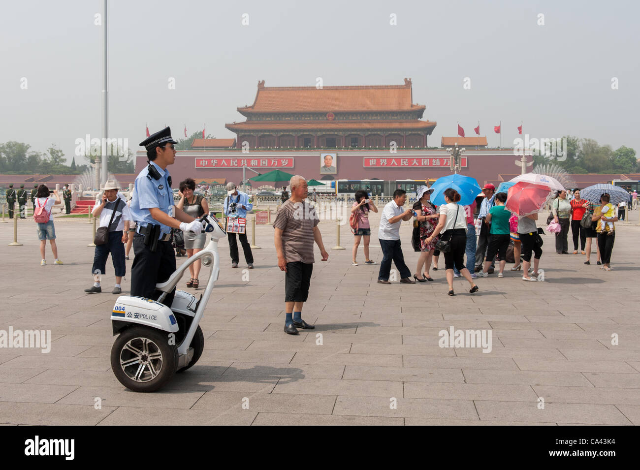 A police officer patrols on Tiananmen Square, Beijing, China on Monday June 4, 2012. June 4th 2012 marks the 23rd anniversary of the military crackdown on students protests at Tiananmen Square in 1989. Stock Photo